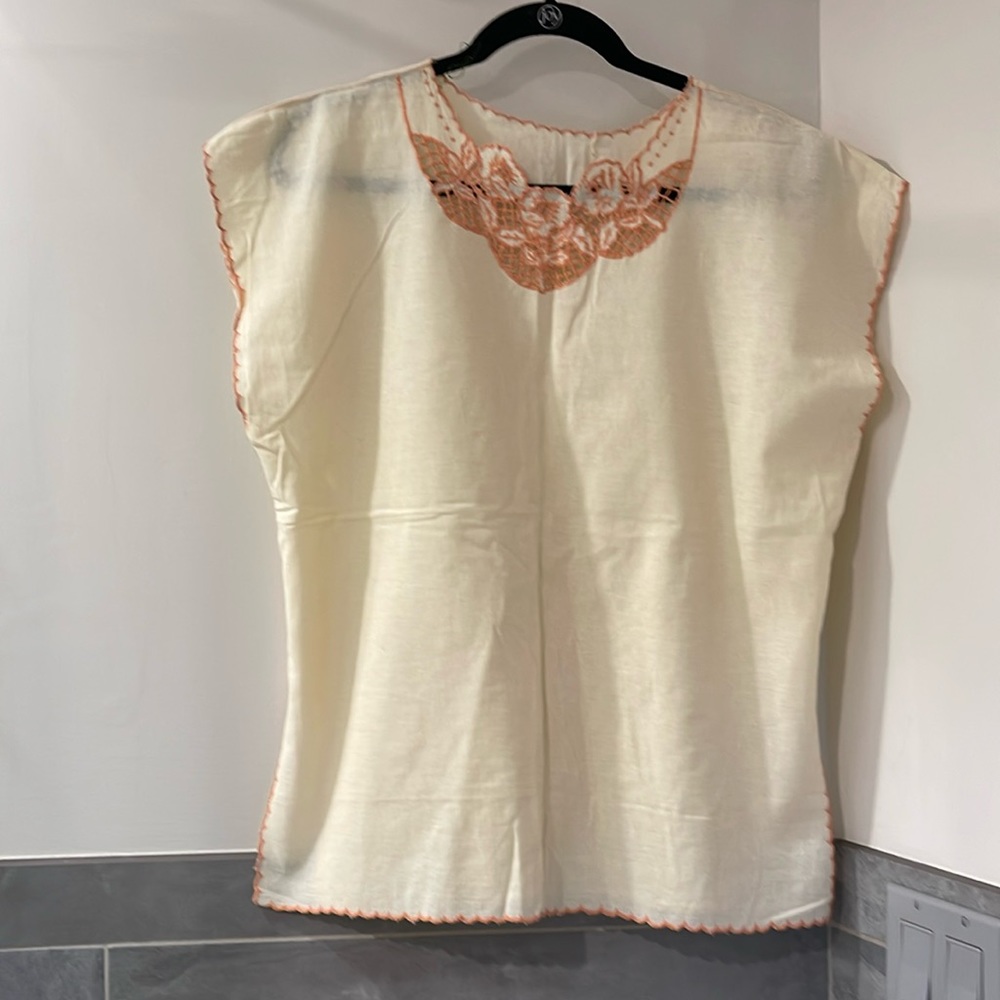 Cotton beige top with embroidered neck